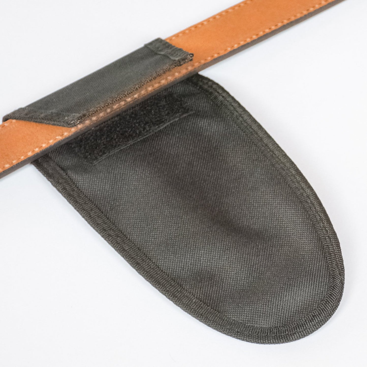 Close up of pruning shears holster and how it attaches to a belt with velcro