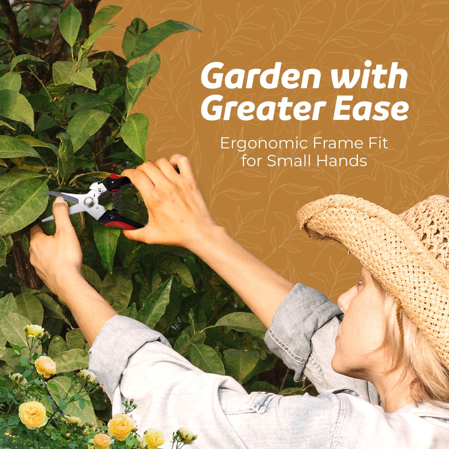 Woman in a denim shirt and straw hand using garden snips to trim a bush