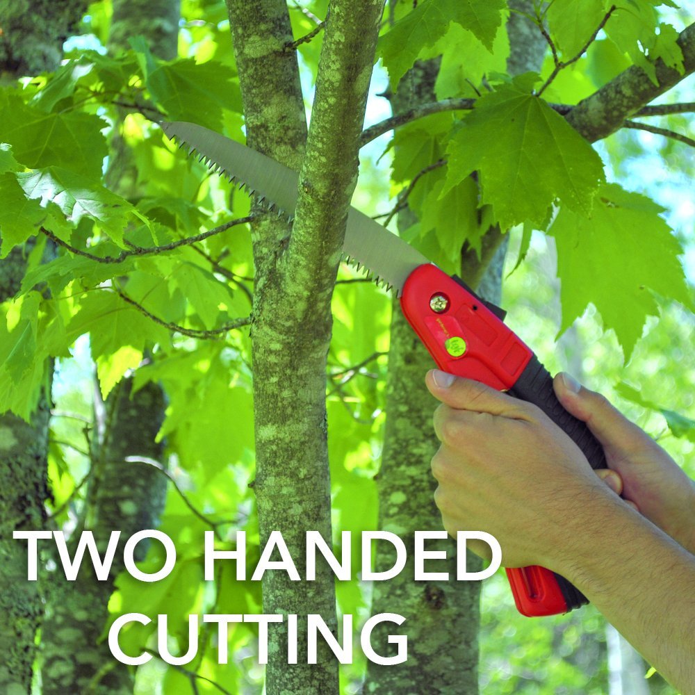 2 hands holding a pruning saw cutting down a large tree branch