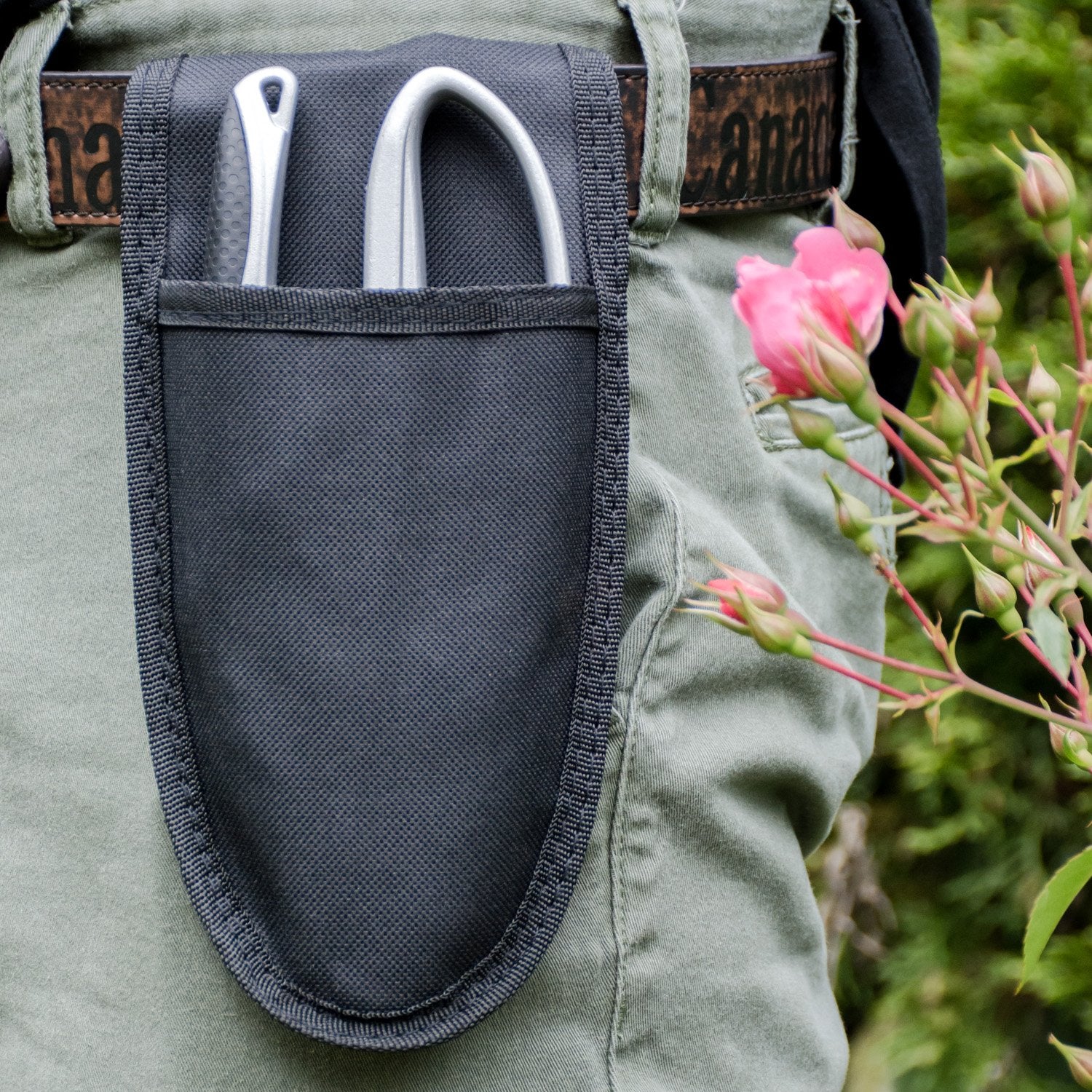 A pruning shears holster attached to waist belt with pruner inside